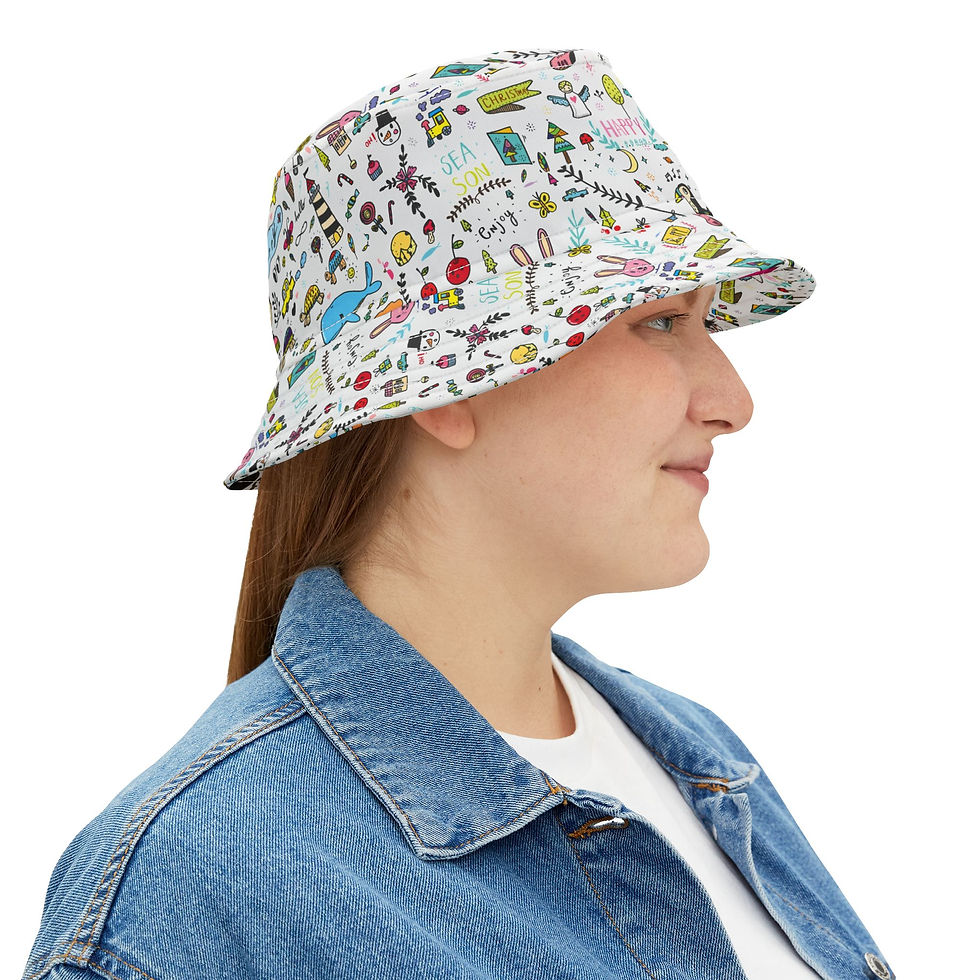 Woman wearing a white bucket hat with colorful doodle-style prints, styled with a denim jacket and white t-shirt, smiling sli