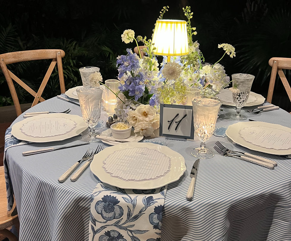 High angle view of wedding reception with dusty blue and cream decorations and light grey seating