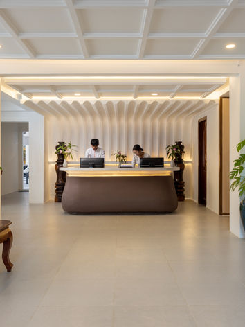 Modern hotel lobby with reception desk and staff