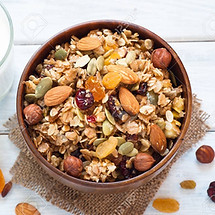 54514188-granola-cereal-flakes-with-dried-fruit-nuts-and-honey-in-a-wooden-bowl-.jpg