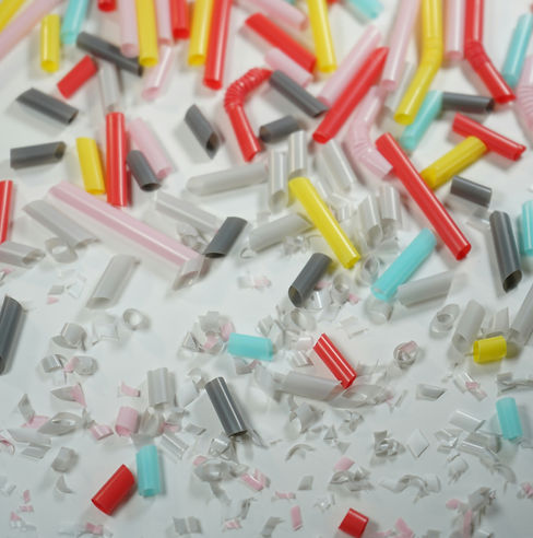 colorful pieces of breaking plastic into smaller microplastic pieces