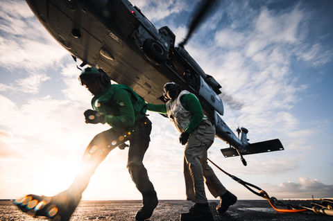An MH-60S Seahawk, assigned to Helicopter Sea Combat Squadron (HSC) 5, picks up nets from the flight deck during a vertical replenishment aboard Nimitz-class aircraft carrier USS George Washington (CVN 73) while underway in the Pacific Ocean, June 14, 2024.