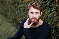 Man with a beard and wavy hair