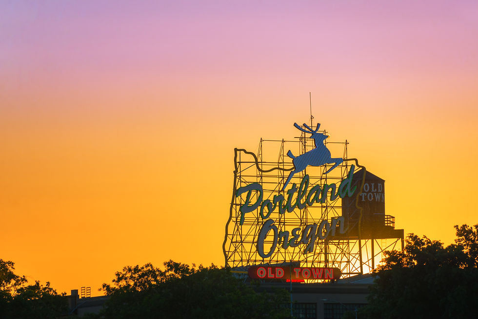 Sunset over the iconic Portland, Oregon Old Town sign in downtown Portland, Oregon.jpg