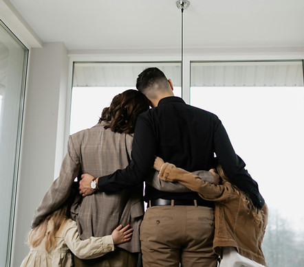 Parents and children hugging in a house symbolizing property inheritance in Florida probate process