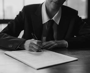 Personal representative signing probate documents at a desk, symbolizing estate administration, legal responsibilities, and management of a Florida probate case.