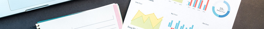 Charts and planning materials representing business outcomes.