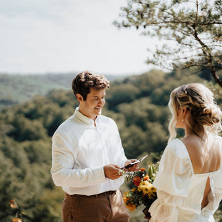 Groom reading vows to bride
