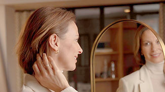 Moment-Sheer_mirror-woman-adjusting-hearing-aid_hero_1920x1080_edited.jpg
