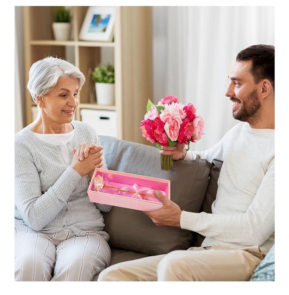 Thumbnail: Man presents pink flowers and gift box to happy senior woman.