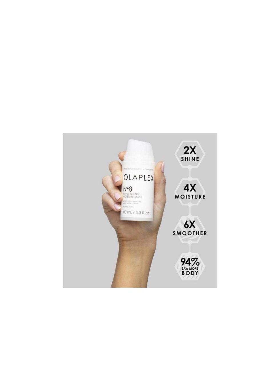 Miniaturebillede: Hand holding OLAPLEX hair product, 2X shine, 4X moisture, 94% less frizz.