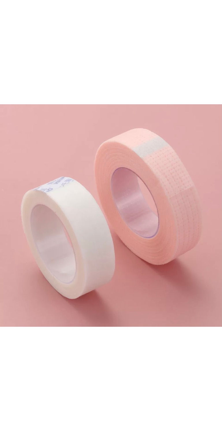 Thumbnail: Two open tape rolls on pink background, beauty product, close-up shot.