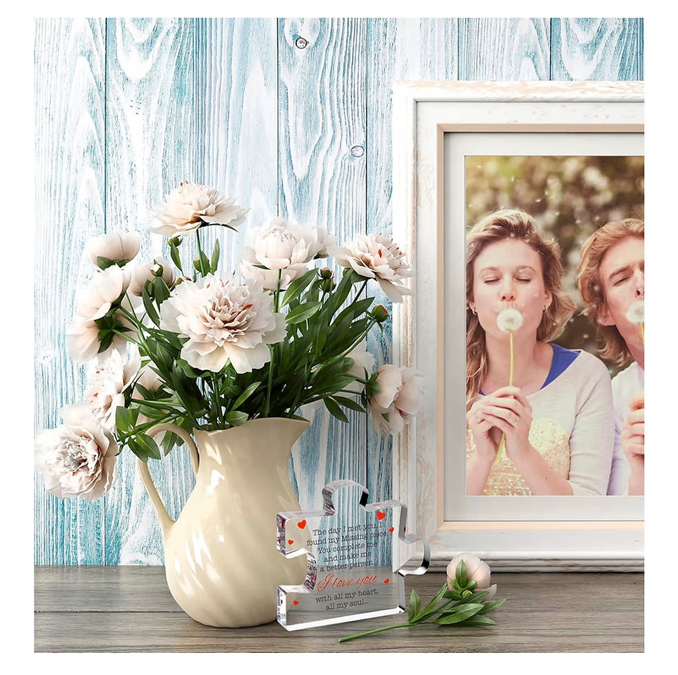 Pink flowers, tiny robot, framed photo of women blowing dandelions.