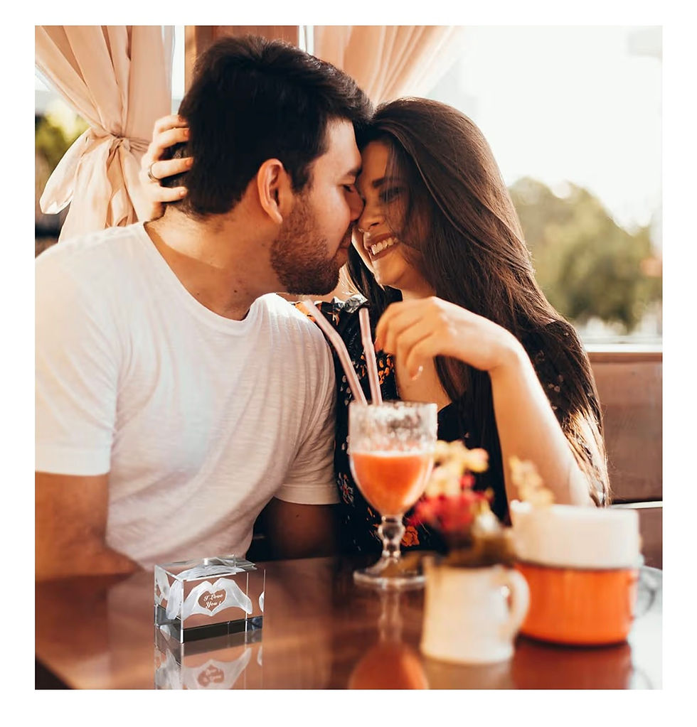 Миниатюра: Happy couple intimately looking at each other at a cafe table.