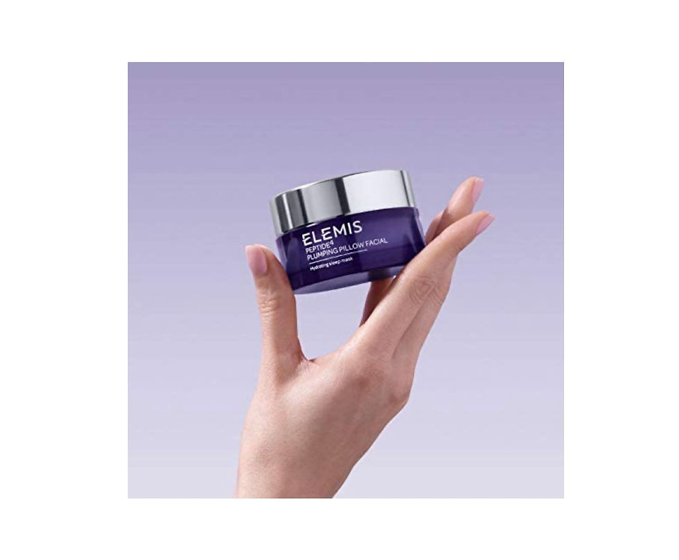 Miniaturbild: Hand holding Elemis Pro-Collagen cream jar, purple background. Skincare product.