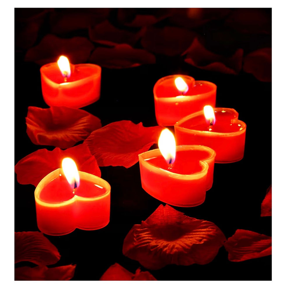 Miniaturbild: Five red heart-shaped candles glowing brightly amidst scattered rose petals.