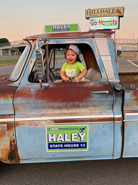 Haley kid in truck.jpeg