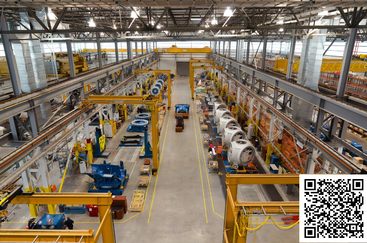 A factory-like work setting with an image of a QR code superimposed at the bottom right corner