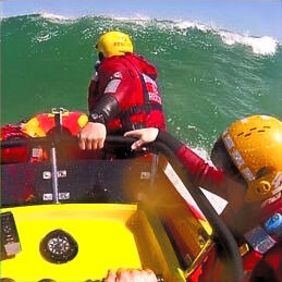 The NSRI taking on a wave with their specially equiped rubberduck
