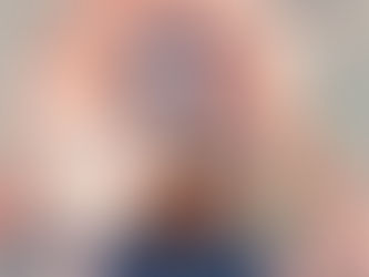 A woman listening to headset and peacefully playing ukulele