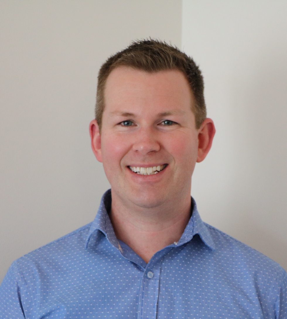 Smiling man with a clean as a whistle look in a blue shirt