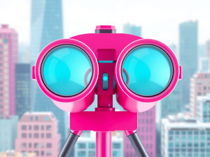 a pair of binoculars making a building clear in the background