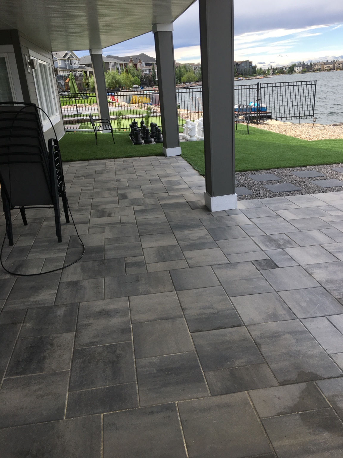 Paver patio beside the home