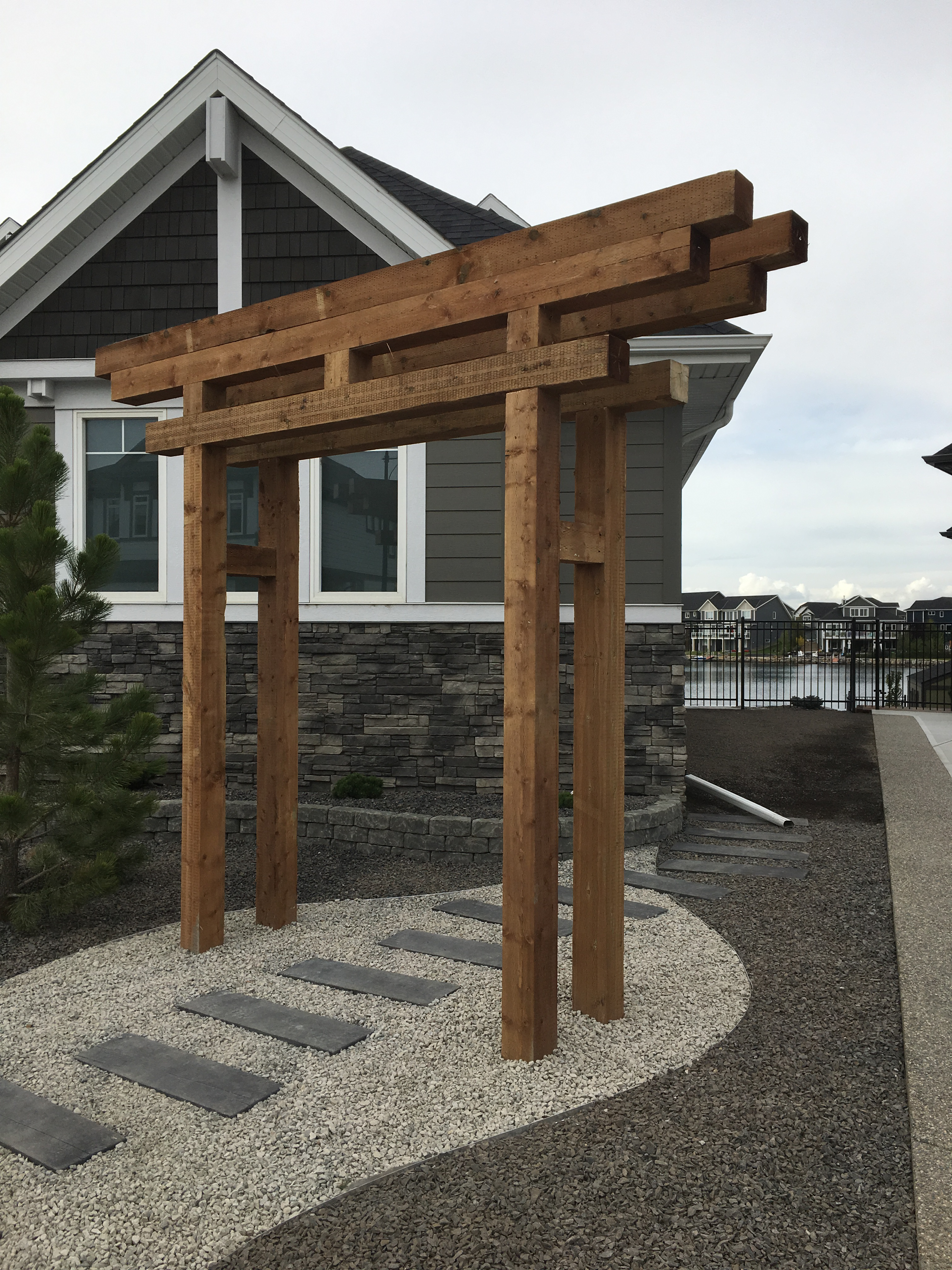Timber archway and stone path