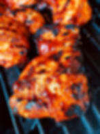 Thumbnail: Close-up of grilled chicken coated in Korean BBQ sauce, showcasing its rich color and appetizing texture.