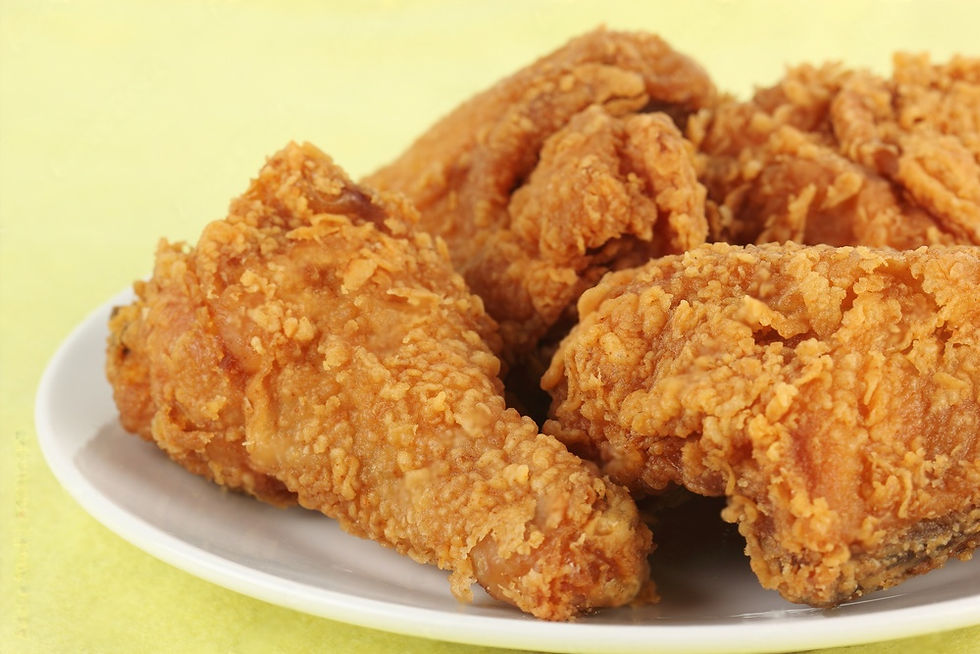 Thumbnail: A wooden table displays a plate of Blazing Extra Crispy Hot & Spicy fried chicken, inviting and appetizing.