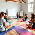 a group of people sitting on yoga mats i