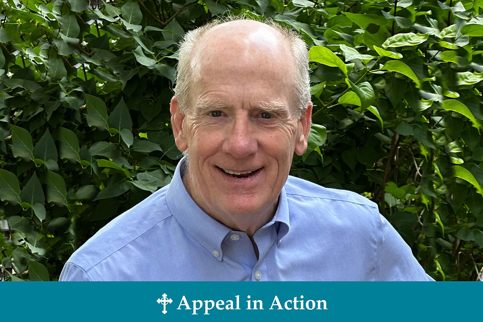 Smiling man in a blue shirt stands in front of lush green foliage. Text below reads "Appeal in Action" with a cross symbol.