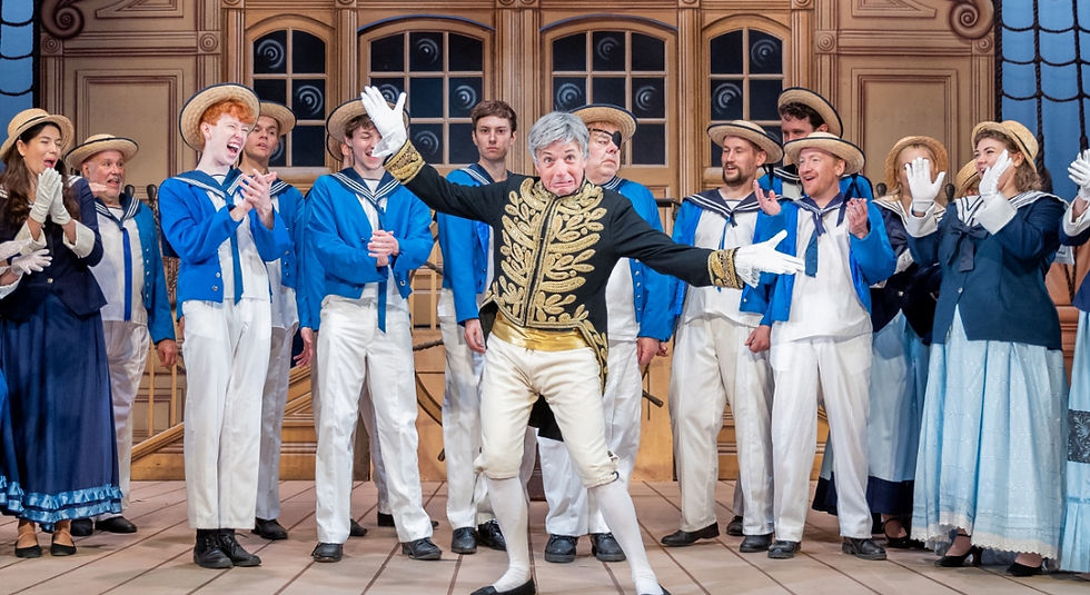Simon Butteriss (Sir Joseph Porter) and the chorus in the National Gilbert & Sullivan Opera Company performance of HMS Pinafore at Buxton Opera House. cr Jane Stokes