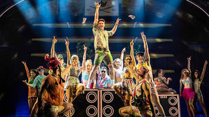 Ashley Day (centre) and the company of Come Fall In Love - The DDLJ Musical