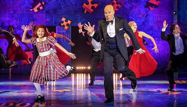 Annie dances with Daddy Warbucks in Annie