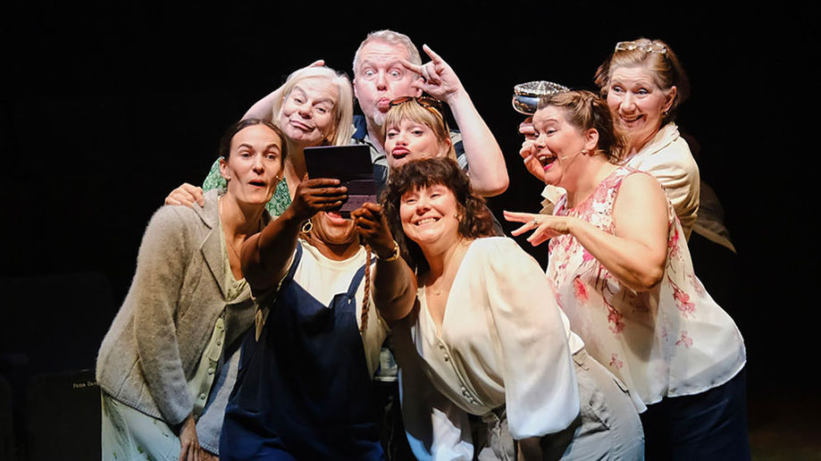 Annie Kirkman, Fenella Norman, Matt Ian Kelly, Pippa Duffy, Sarah Groarke, Karen Holmes, Christine Meehan, Alicia McKenzie (face hidden by phone) in "Calendar Girls, The Musical". Pic: Tony Bartholomew