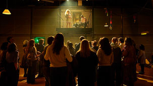 Audience members watch actors perform on a small balcony-platform above the ground in Road Road at the Royal Exchange, Manchester. All pics: Ros Kavanagh