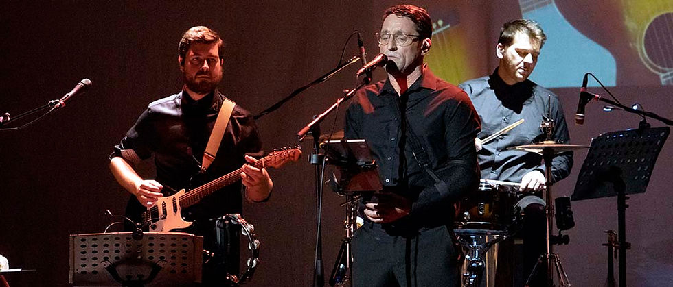 Daniel Taylor, and band, and shoulder brace, in Something About George - the George Harrison Story. All pics: David Munn Photography