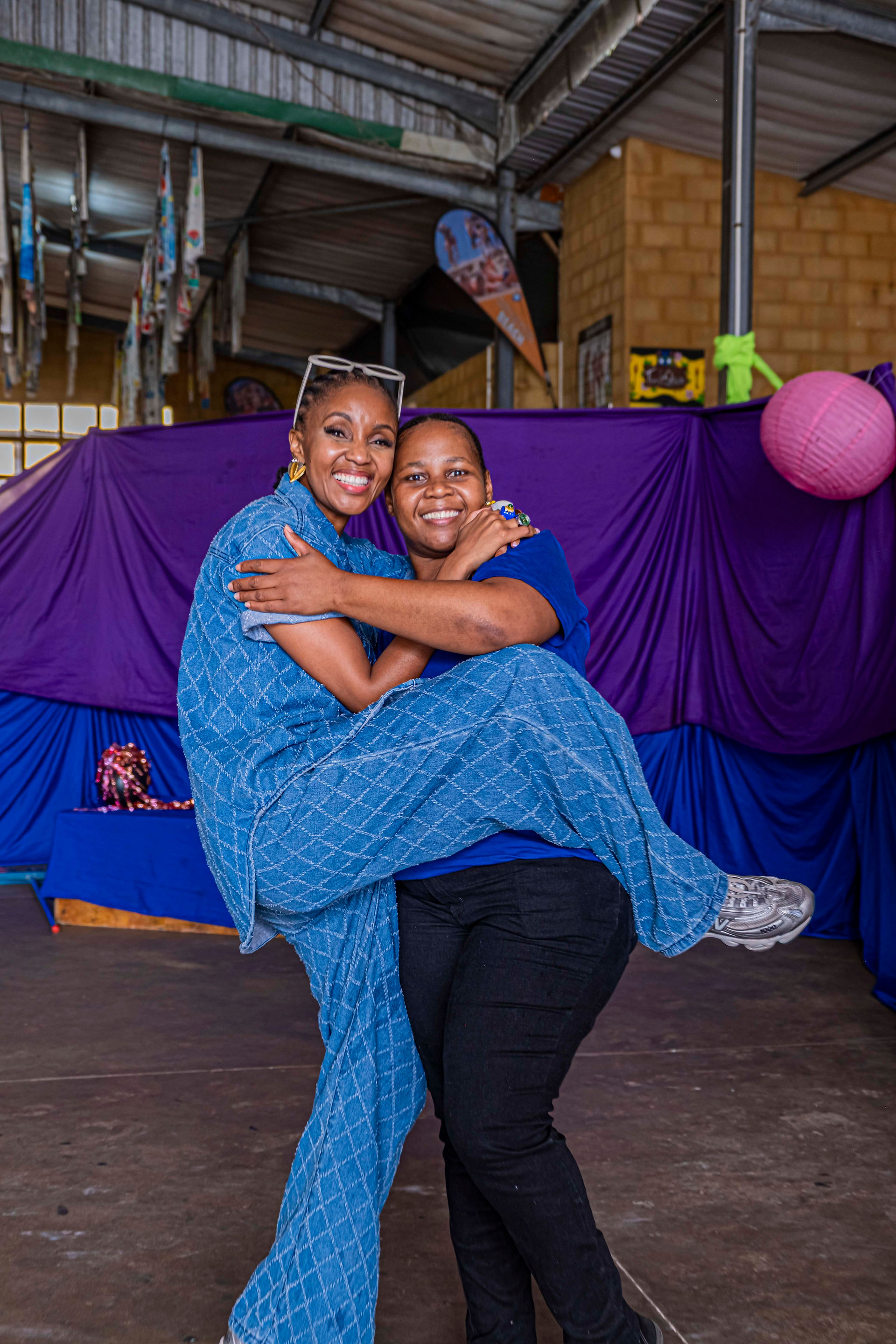 Lunathi Mampofu poses with Sugar Bay Camp Team
