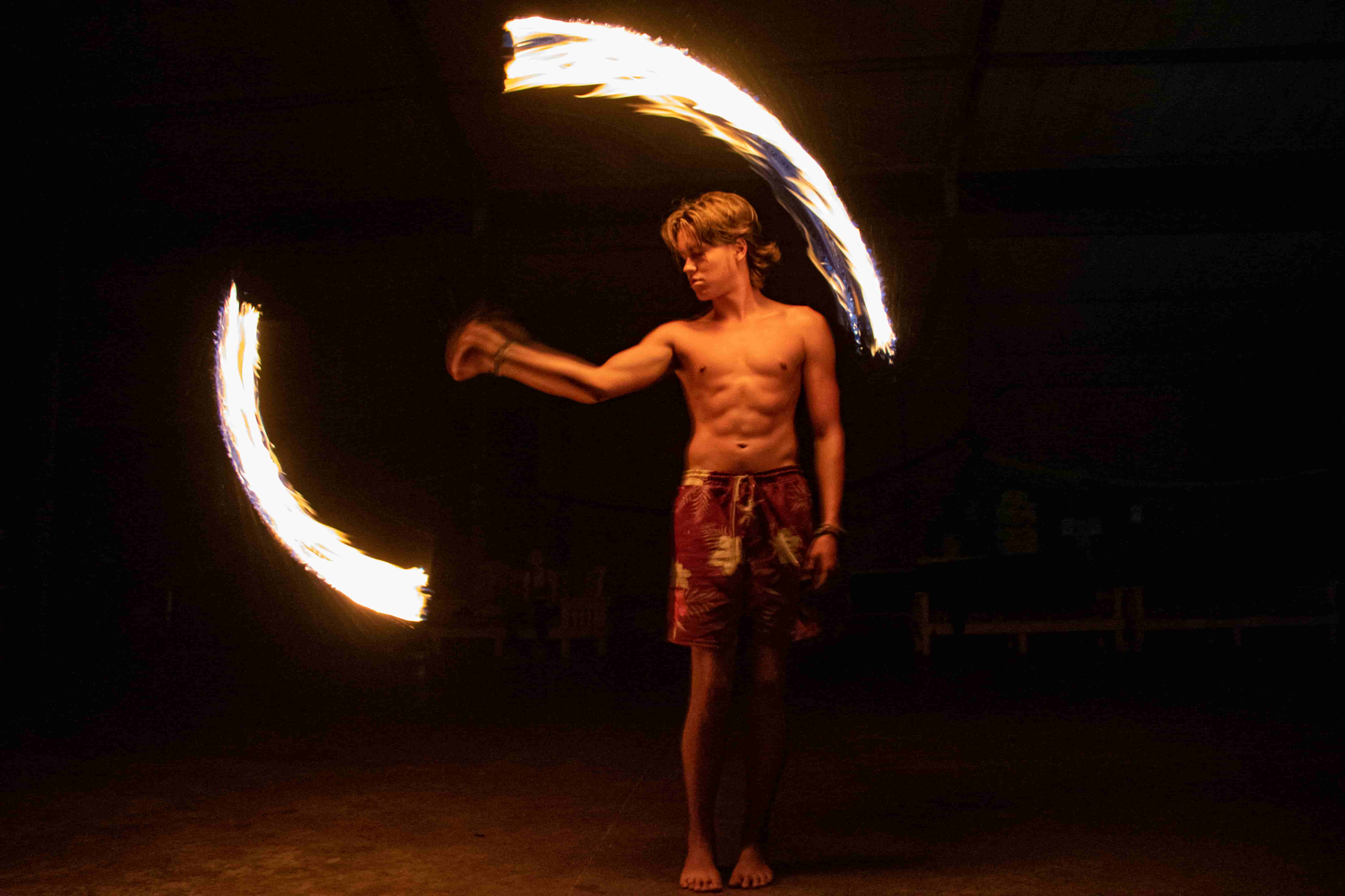 Sugar Bay participant performing a fire-spinning routine