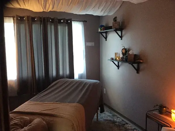 Blue Renew massage therapy room in Portland, Oregon with massage table, calming candles, and peaceful decor for Swedish and Deep Tissue massage