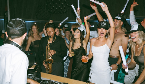 raging dancefloor with light sticks by second song