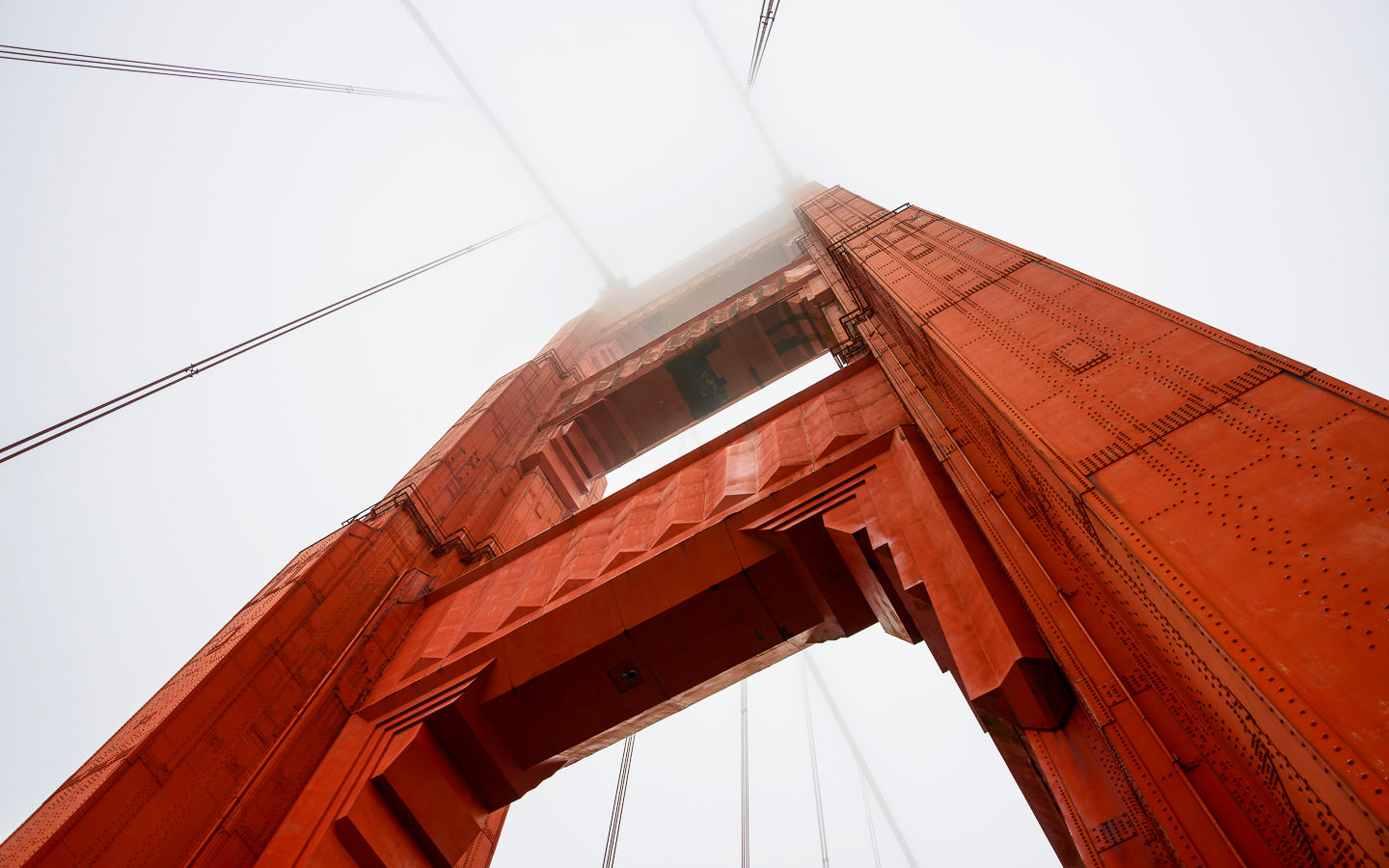 The Golden Gate Bridge steel tower shrouded in coastal fog. Landscape photography prints for sale.