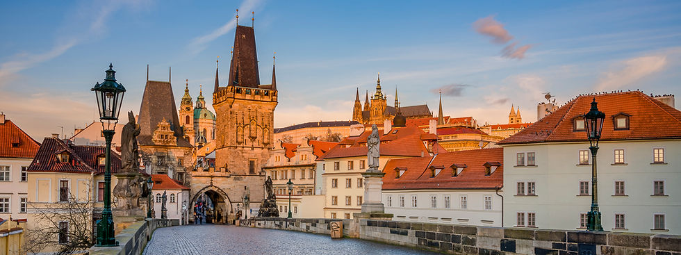 Awaking Prague bathed in the golden light of sunrise. Photography print for sale.