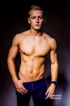 Dave is topless wearing only jeans