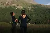 Woman practicing yoga outdoors in St. Moritz mountain landscape
