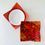 Thumbnail: Microwavable reversible bowl cozy with orange batik patterned fabric