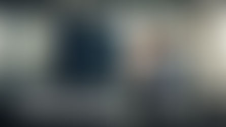 HR professionals collaborating with AI-driven data dashboards in a bright office, symbolizing accountability and the human side of digital transformation.