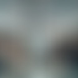 Indonesian business leaders in a modern Jakarta office discussing strategy around a glass table, symbolizing culture, compliance, and compassion in HR transformation 2026.