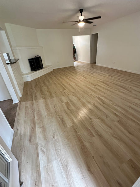 Open concept living space remodel with updated flooring and modern finishes in Plano Texas
